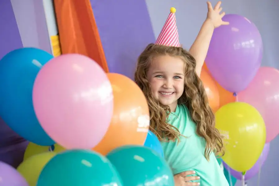 Birthday party with a young girl and ballons